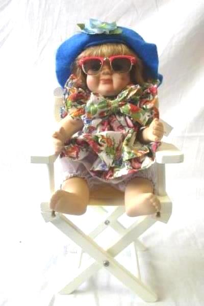 Multi-Colored Beach Themed Porcelain Doll With Glasses Hat And Beach Chair