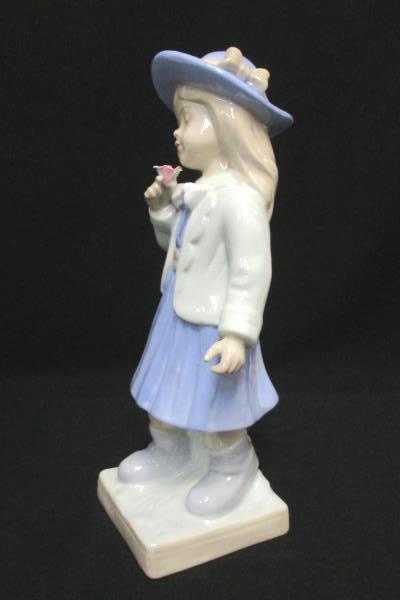 Porcelain Girl Figurine Holding Flower Eyes Closed Sweet Face Lilac Dress Hat