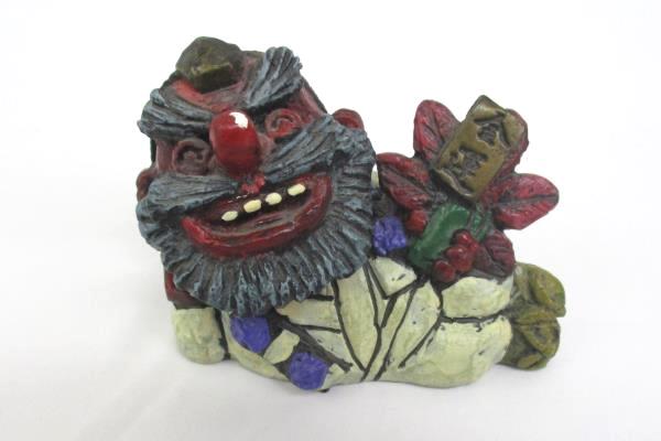 2010 Seto Craft Figurine Folk Art Reclining Man Holding A Red Flower Decorative