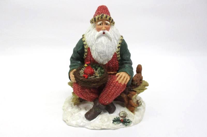 Santa Sitting On A Log Holding A Cardinal Nest Figurine Holiday Collectible