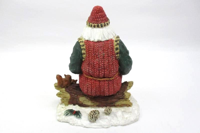 Santa Sitting On A Log Holding A Cardinal Nest Figurine Holiday Collectible