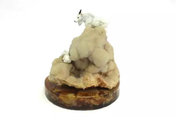 Geode Specimen Featuring Bone China Mountain Goats And Lucite Rock Base