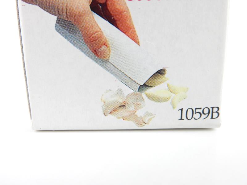 Norpro Garlic Peeler fits Up to 4 Cloves Inside Press Down And Roll