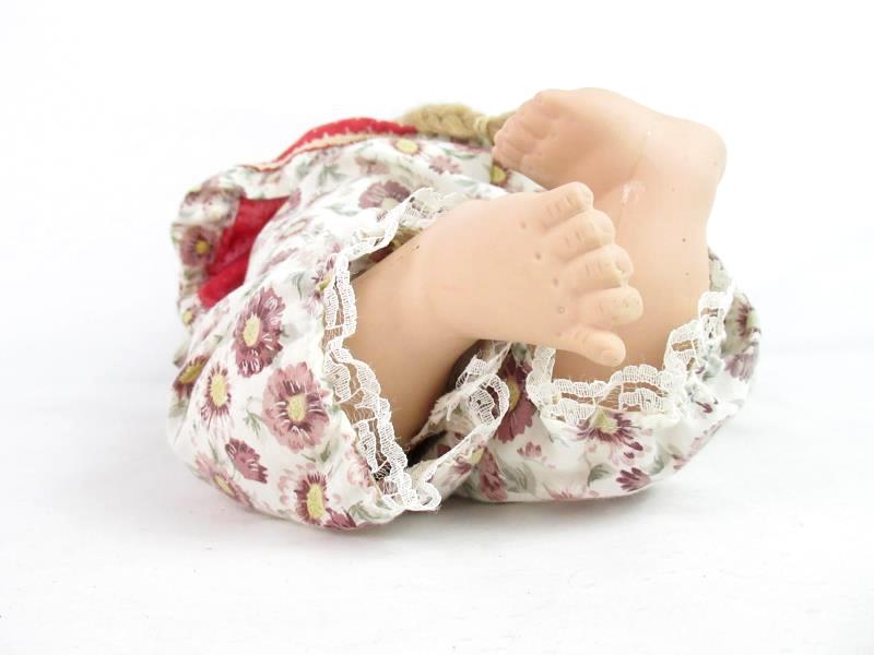 Blonde Haired Porcelain Doll Laying On Her Belly 16.5 Inches Long