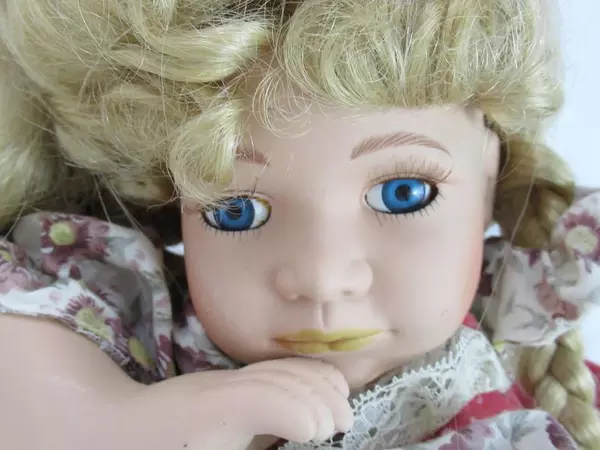 Blonde Porcelain Doll Laying on Belly 16.5 Inches Long Collectible Toy