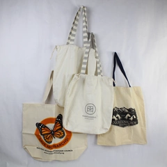 Lot of 4 Eco-Friendly Beige Canvas Tote Bags with Graphic Designs