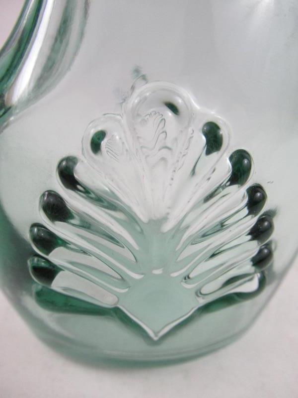 Green Tinted Embossed Bottle With Handle And Cork Stopper Made In Canada