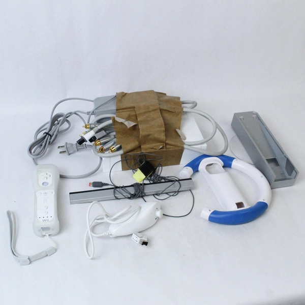 Nintendo Wii Bundle With Wheel Remote Nunchuck and Remote Dock Untested