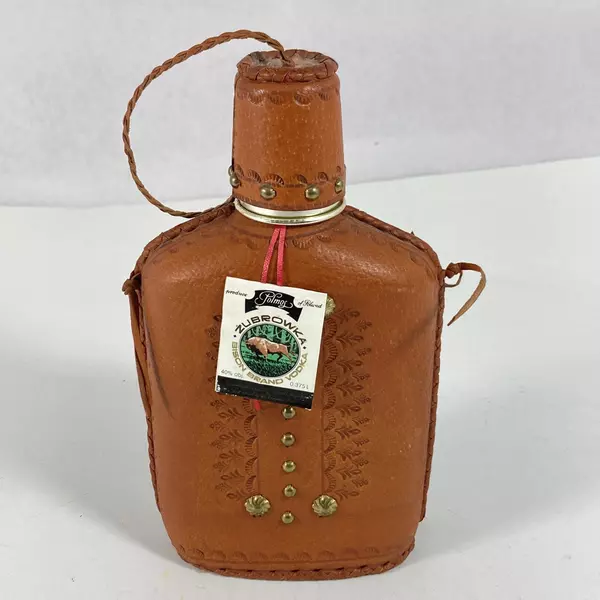 Empty Zubrowka Bison Brand Vodka Flask And Shot Glass Tooled Leather Over Glass