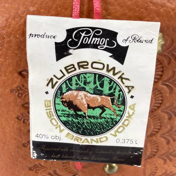 Empty Zubrowka Bison Brand Vodka Flask And Shot Glass Tooled Leather Over Glass