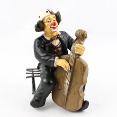 Vintage Clown Figurine Playing the Cello Sitting On A Metal Bench