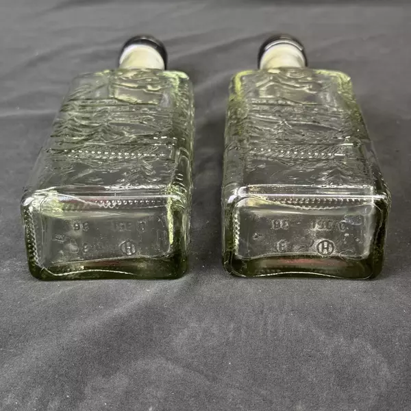 Lot of 2 Brennerei Gruner Baum Embossed Forest Scene Brandy or Liquor Bottles