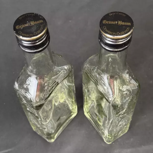 Lot of 2 Brennerei Gruner Baum Embossed Forest Scene Brandy or Liquor Bottles