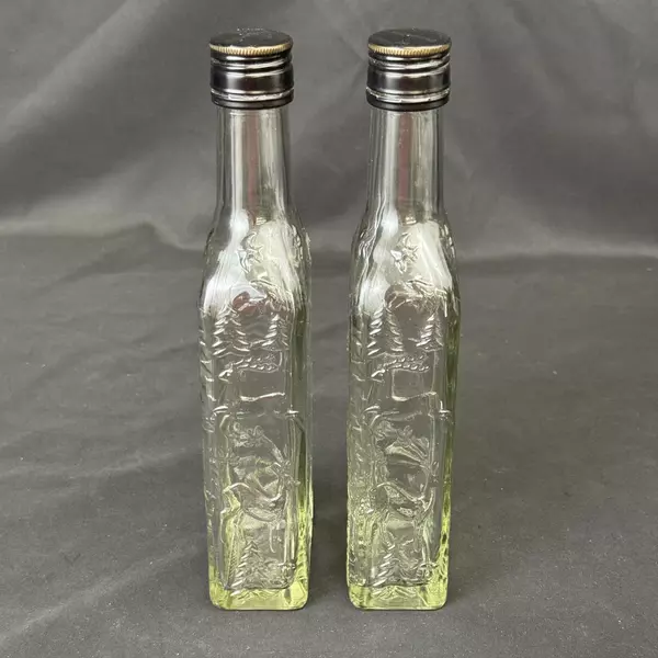 Lot of 2 Brennerei Gruner Baum Embossed Forest Scene Brandy or Liquor Bottles
