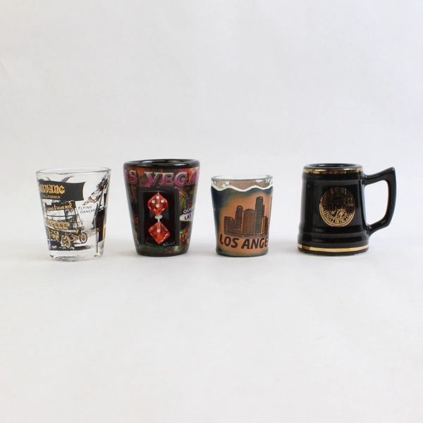 Lot Of 4 Assorted Shot Glasses Los Vegas CU Los Angeles Solvang California
