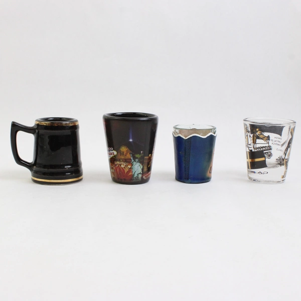 Lot Of 4 Assorted Shot Glasses Los Vegas CU Los Angeles Solvang California
