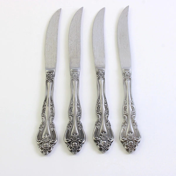 Set of 4 International Chalmette Stainless Steel Solid Handle Steak Knives