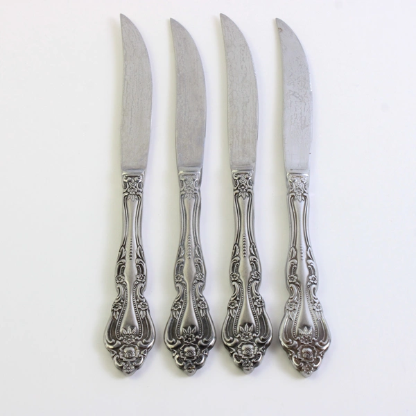 Set of 4 International Chalmette Stainless Steel Solid Handle Steak Knives