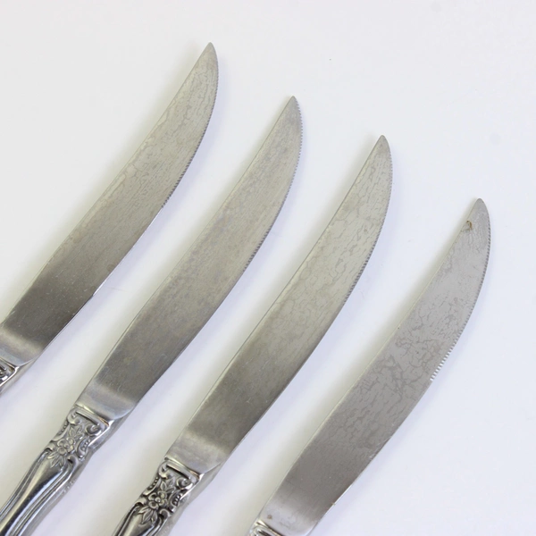 Set of 4 International Chalmette Stainless Steel Solid Handle Steak Knives
