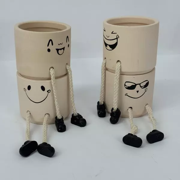 Set of 4 Smiling Ceramic Shelf Planters with Legs And Feet Beige