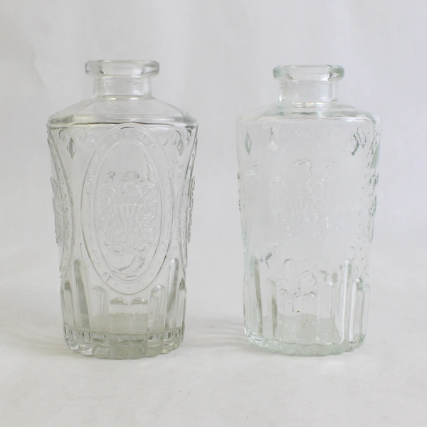 Set Of 2 Matching Unbranded Embossed Decorative Clear Glass Bottle/Vases 5" Tall