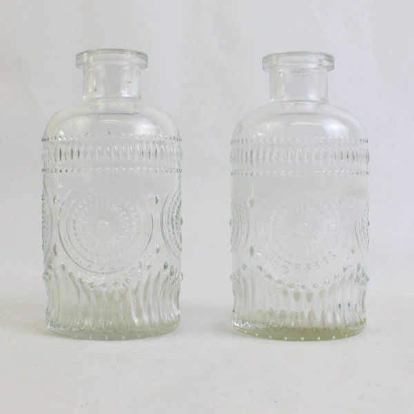 Set Of 2 Unmarked Decorative Embossed Clear Glass 5.25" Tall Bottle/Vases