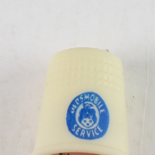 Advertising Thimble Oldsmobile Service Blue Print Cream Plastic Vintage