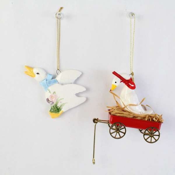 Lot of 2 White Duck Ornaments 1 Schmid And 1 Unbranded Sitting In Red Wagon
