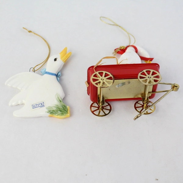 Lot of 2 White Duck Ornaments 1 Schmid And 1 Unbranded Sitting In Red Wagon