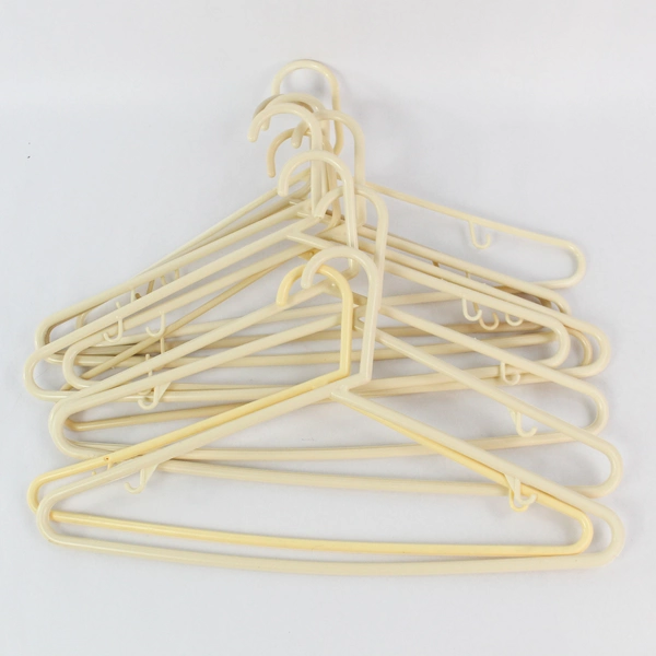 Lot of 10 Cream Colored Plastic Tubular Clothes Hangers With Hooks