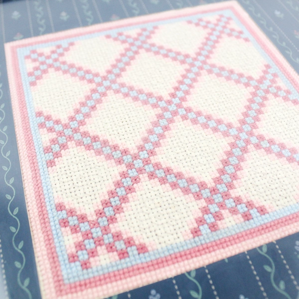 Framed and Matted Pink Blue and White Cross Stitch Square Wall Art