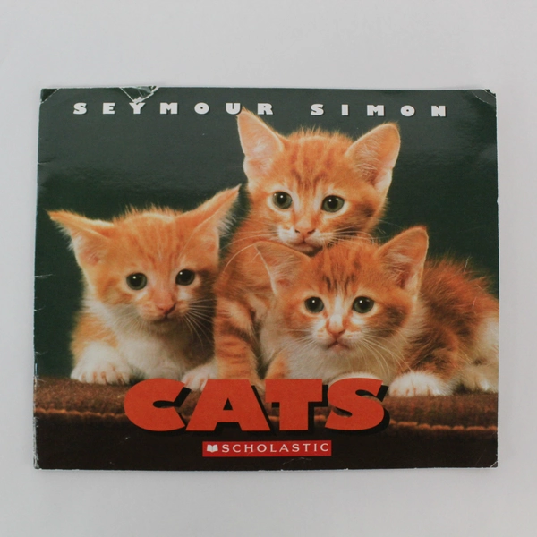 Cats by Seymour Simon 2004 Scholastic Paperback - Good Pre-Owned, Torn Cover