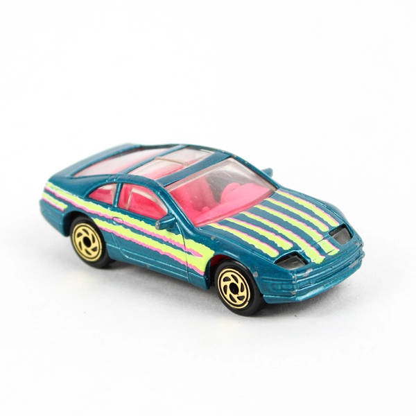 1990 Matchbox Nissan 300ZX Diecast Car Teal Pink Yellow Stripes Retro