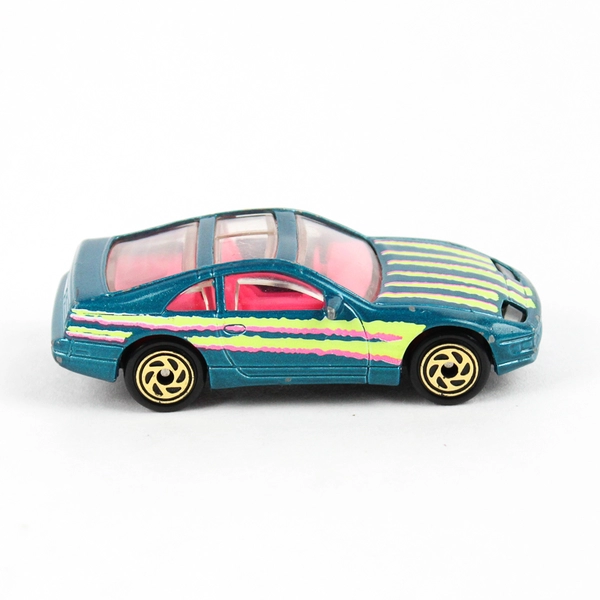 1990 Matchbox Nissan 300ZX Diecast Car Teal Pink Yellow Stripes Retro