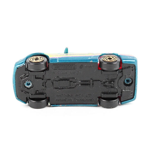 1990 Matchbox Nissan 300ZX Diecast Car Teal Pink Yellow Stripes Retro