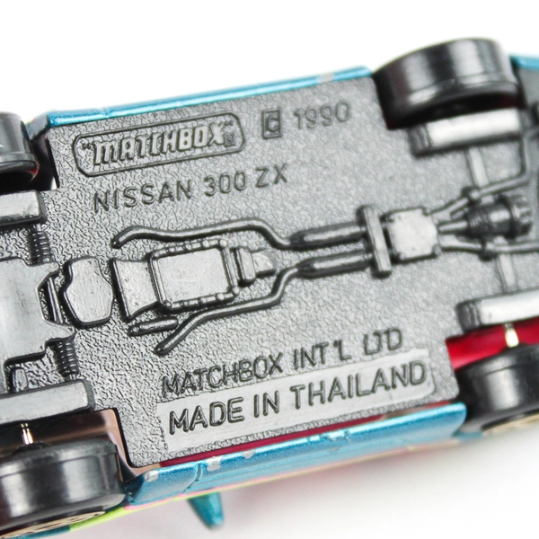1990 Matchbox Nissan 300ZX Diecast Car Teal Pink Yellow Stripes Retro