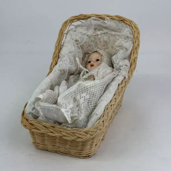 Vintage Sankyo 9 Inch Porcelain and Cloth Baby Doll With Bassinet