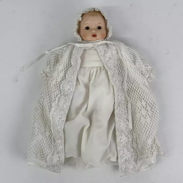 Vintage Sankyo 9 Inch Porcelain and Cloth Baby Doll With Bassinet