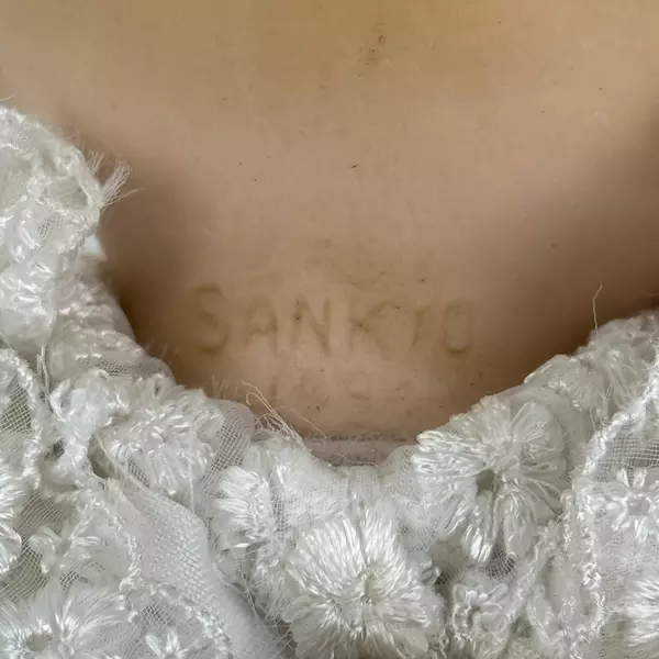 Vintage Sankyo 9 Inch Porcelain and Cloth Baby Doll With Bassinet