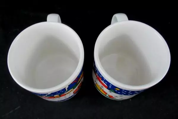 Set of 2 White Christmas Coffee Mugs with Holiday Scenes - Pre-Owned