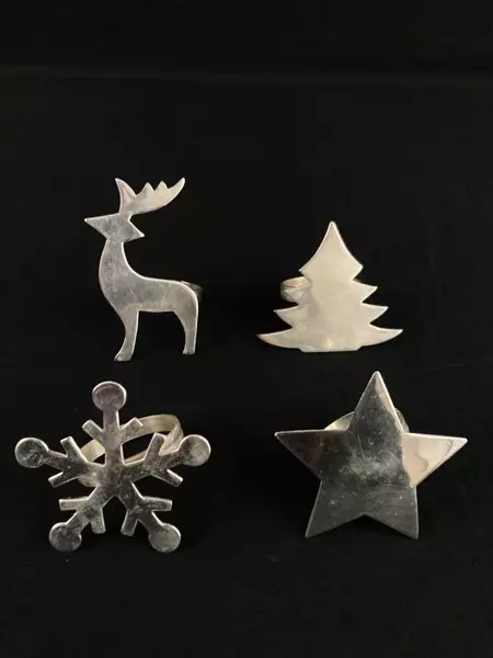 Set of 4 Pier 1 Metal Christmas Napkin Rings Star Snowflake Tree Reindeer