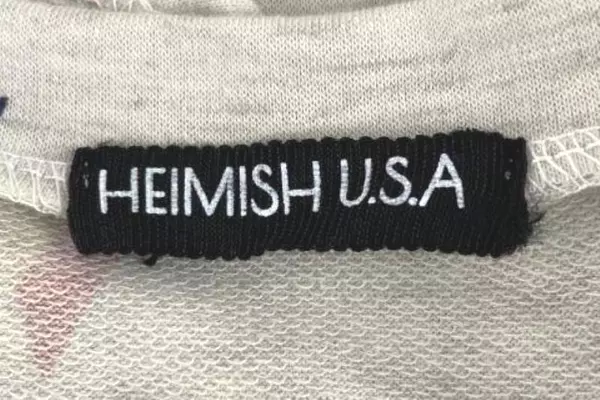 Heimish USA Women's Large Beige Star Print Short Sleeve Top - V-Neck Shirt