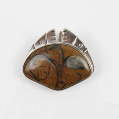 Decorative Sterling Silver Pendant with Brown and Black Stone Setting