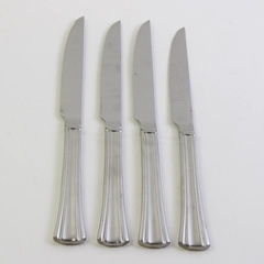 A Set of 4 Reed & Barton Brookshire Stainless Solid Handle Steak Knives 9.75 In