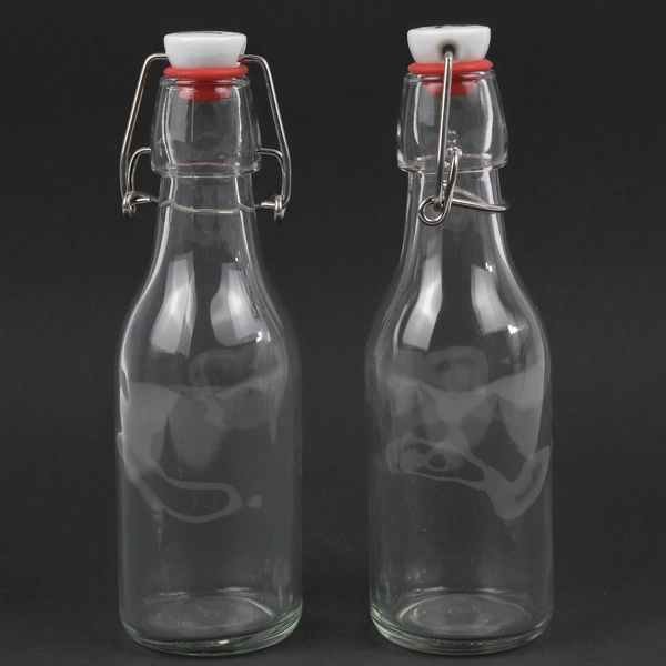 Lot Of 2 Yeboda Clear Glass Bottles With Swing Top Lid 7.75" Tall