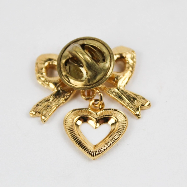 Vintage Gold-Tone Bow with Dangling Heart Red Stone Lapel Pin