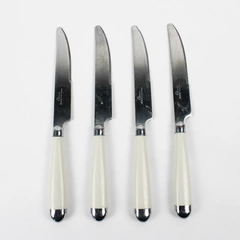 Lot of 4 Gibson Stainless White Plastic Handles Serrated Dinner Knives 8.25"