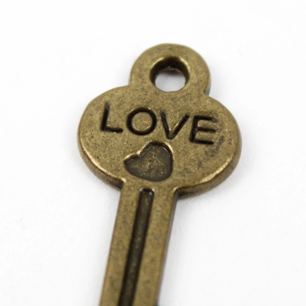 Lot of 17 Miniature Antiqued Gold Heart Key Charms with Love