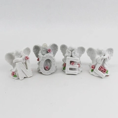 4 Piece White Ceramic Angel Figurines With Pink Roses Spelling NOEL 3.5"