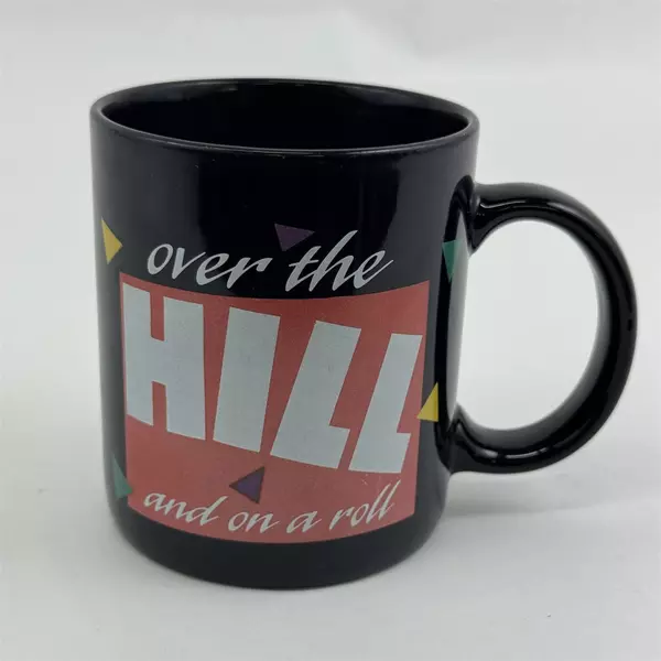Russ Berrie & Co Inc "Over The Hill And On A Roll" Black Ceramic Mug 3.75" Tall